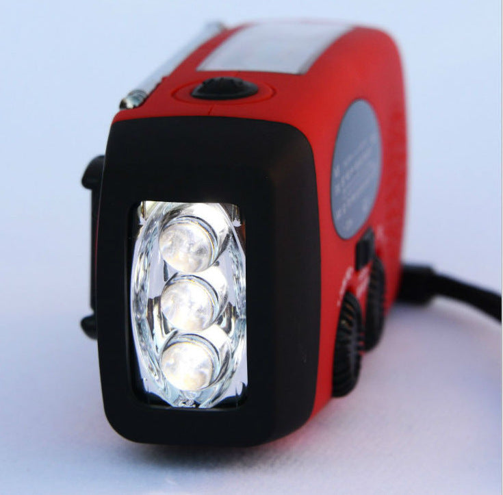 Solar hand crank USB charging radio flashlight capnig