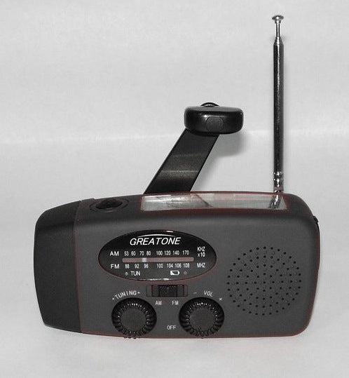 Solar hand crank USB charging radio flashlight capnig